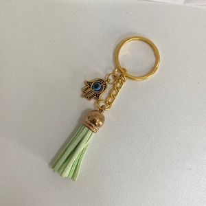 Gold and light green evil eye keychain